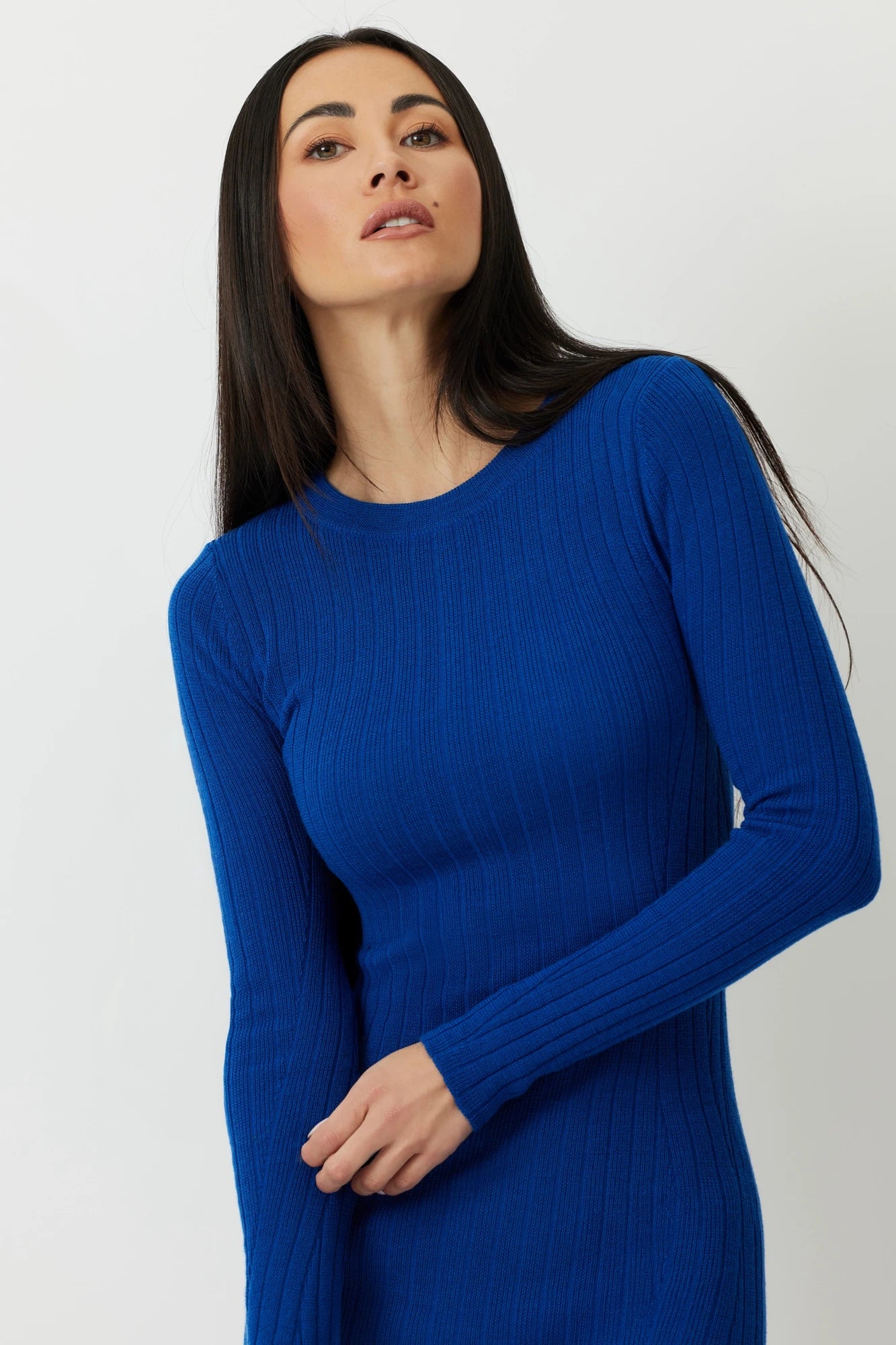 Model wearing the Lapis Blue Black Galloway Long Sleeve Ribbed Top, highlighting the rich color and texture of Merino wool.