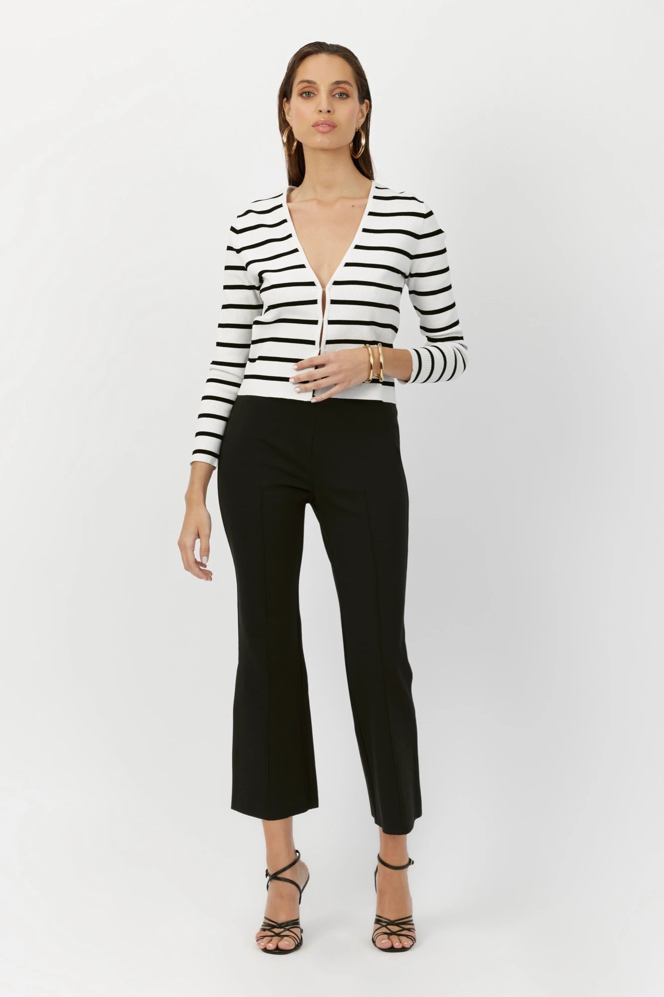 Model wearing the Breton Stripe Gemma Ribbed Knit Cardigan, illustrating its classic stripe pattern and elegant fit.