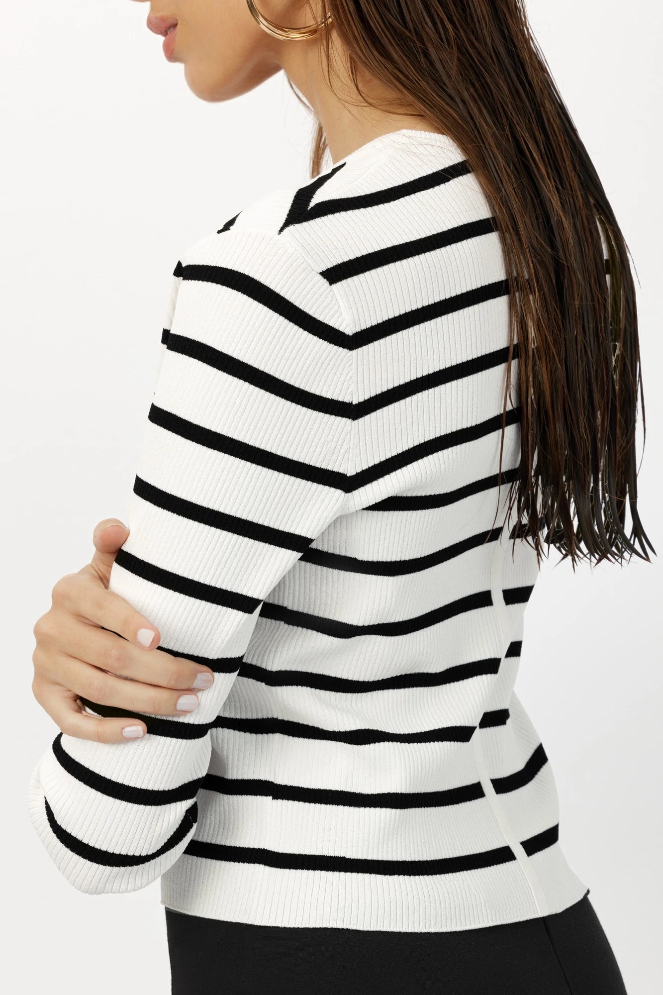 Model wearing the Breton Stripe Gemma Ribbed Knit Cardigan, illustrating its classic stripe pattern and elegant fit.