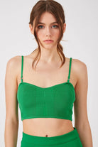 The Glow knitted bra in kelly green by Greyven