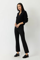 The Porterfield crop nip tuck flare pants in black by Greyven.