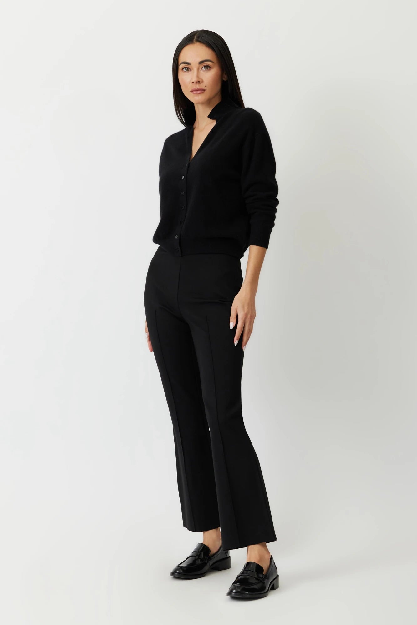 The Porterfield crop nip tuck flare pants in black by Greyven.