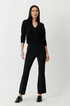 The Porterfield crop nip tuck flare pants in black by Greyven.