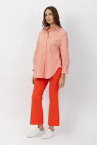 The Porterfield crop nip tuck flare pants in orange crush by Greyven