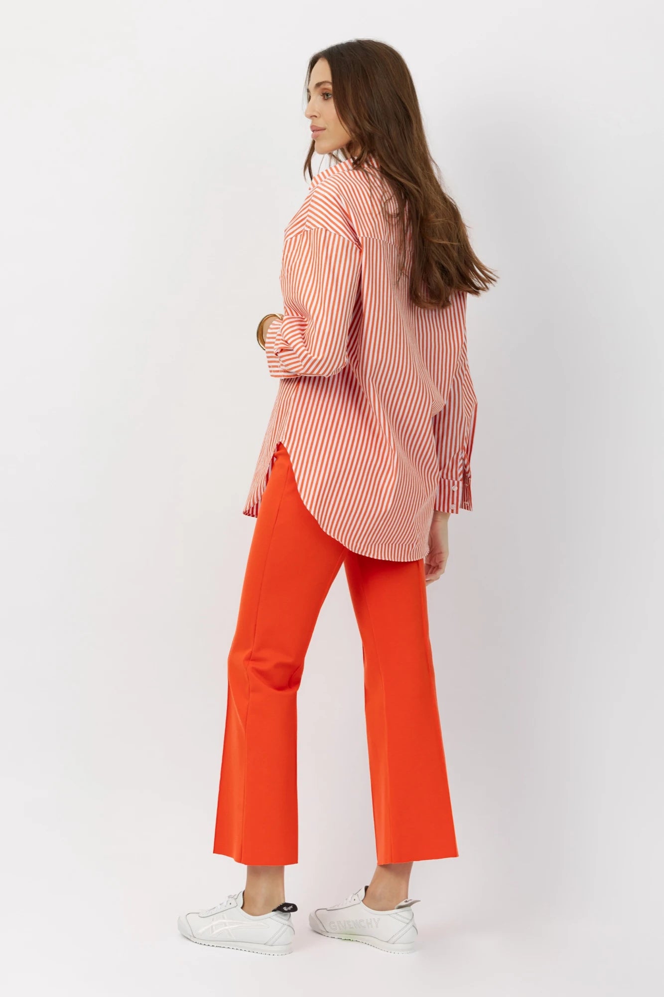 The Porterfield crop nip tuck flare pants in orange crush by Greyven