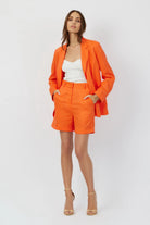 The Riley summer linen blazer in orange crush by Geyven